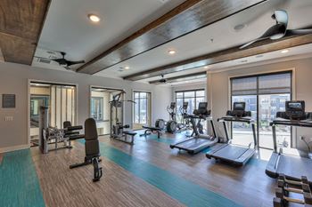 24-Hr fitness center with peloton, free weights, and more